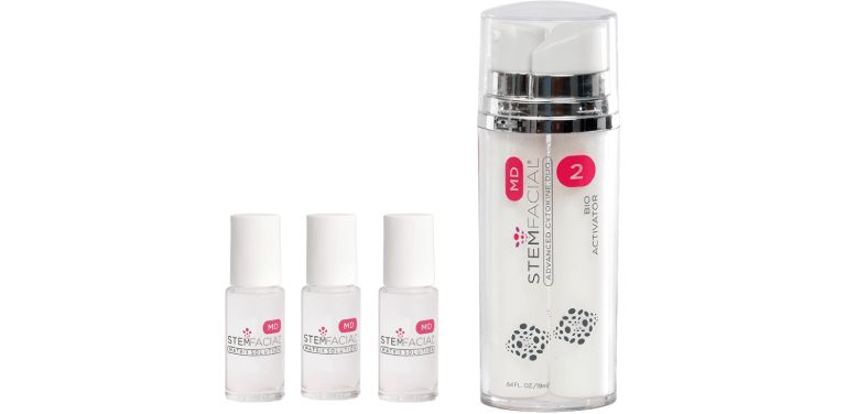 STEMfacial MD skincare set with three small serum vials and large Bio Activator 2 pump bottle on white background