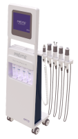 Préime DermaFacial machine with touchscreen, serum cartridges, and four treatment handpieces on wheeled base